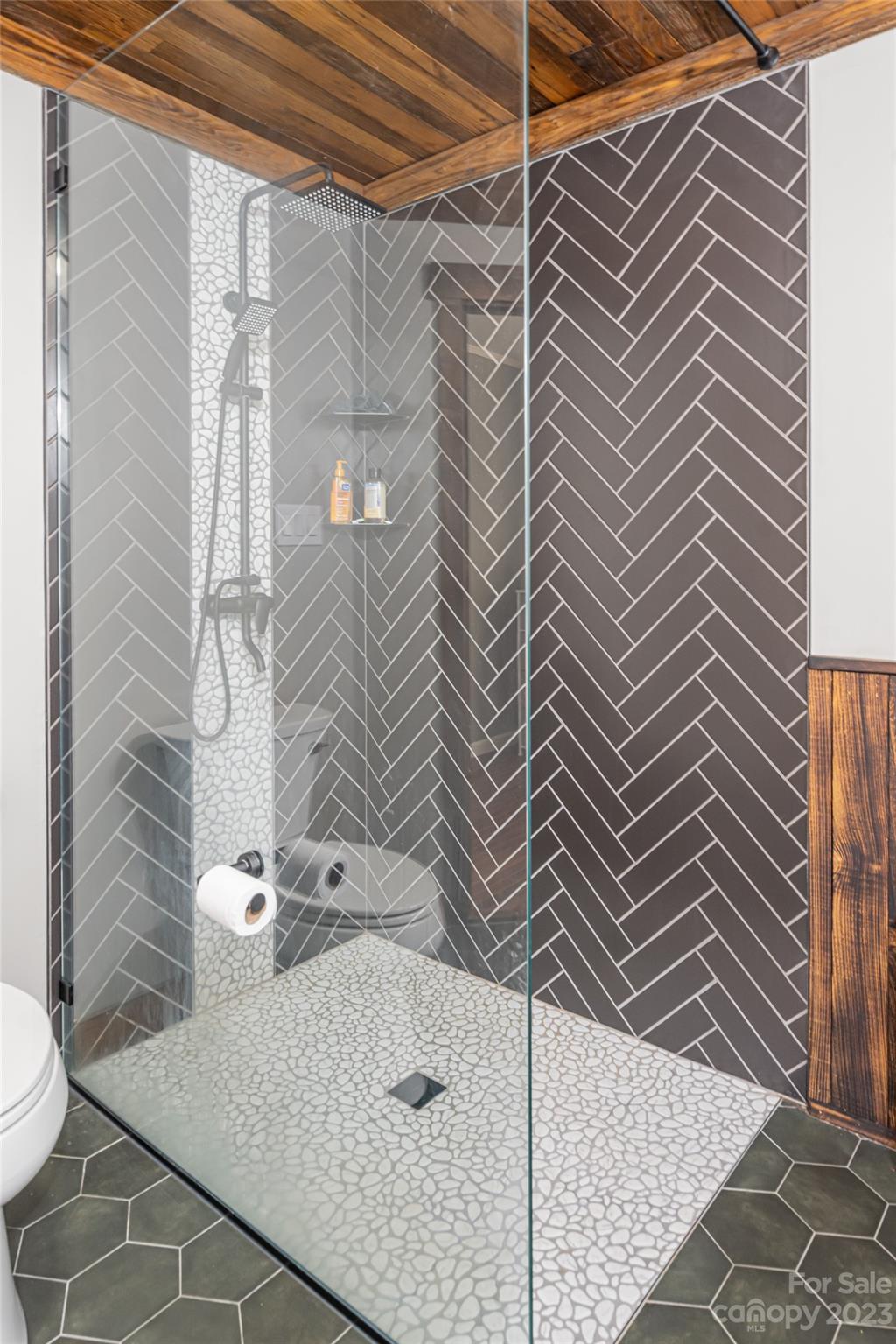 142 Blake Drive Canton, NC 28716 - Photo 10 of 44 a bathroom with a sink toilet and shower