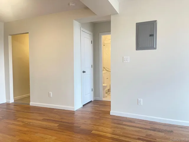 a white toilet sitting next to a bath tub