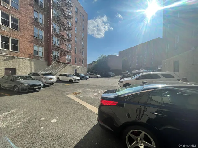 a view of a swimming pool with a patio and a yard
