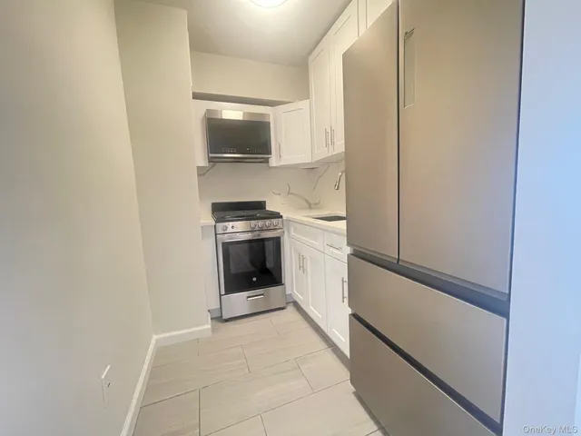 a kitchen with a stove and a sink