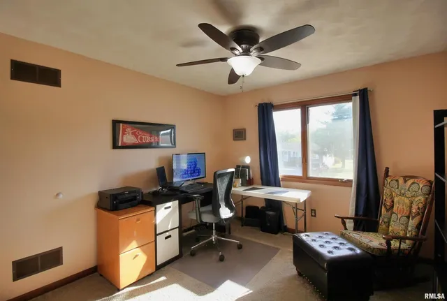 a living room with furniture and window