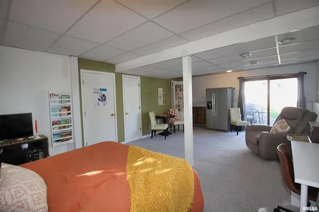 a bed room with a bed and furniture