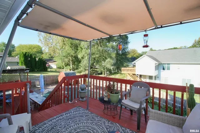 a view of a two chairs in the deck