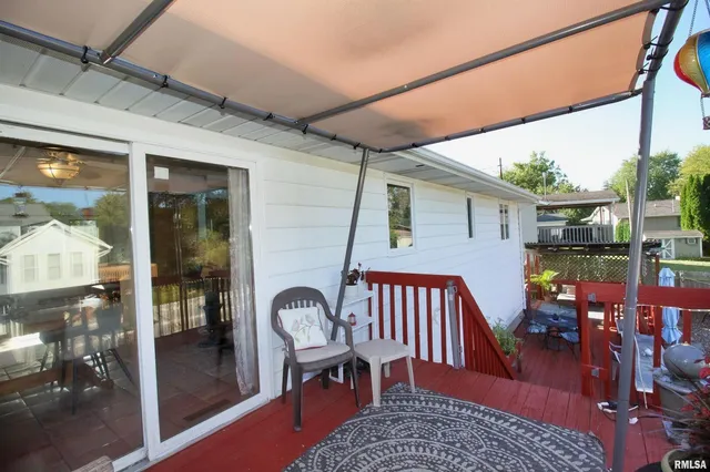 a view of a balcony with furniture