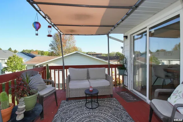 a balcony with furniture