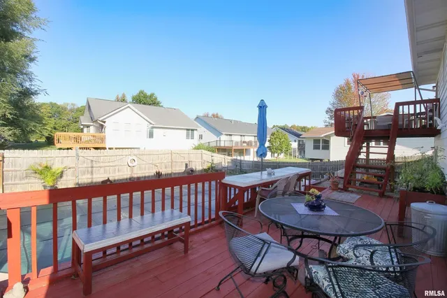 a view of a chairs and table in patio