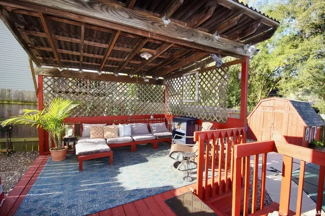 a outdoor living space with patio lots of furniture