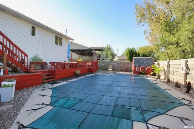 a view of a backyard with sitting area
