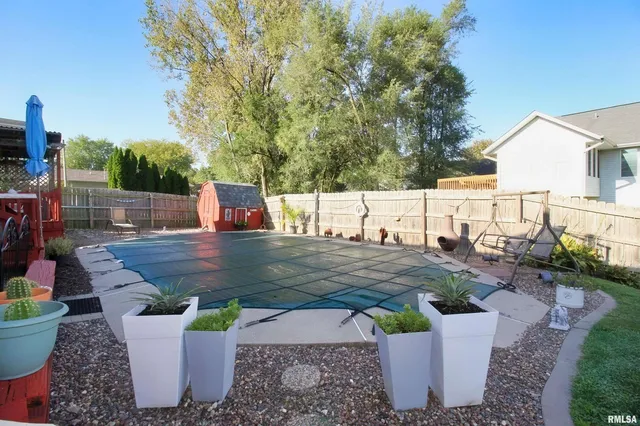 a view of a backyard with sitting area
