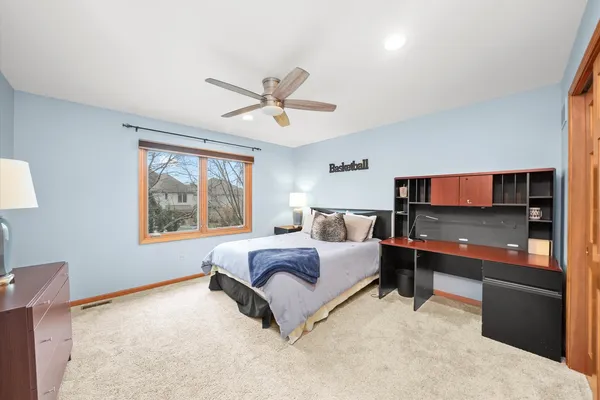 a spacious bathroom with a double vanity sink a mirror and a