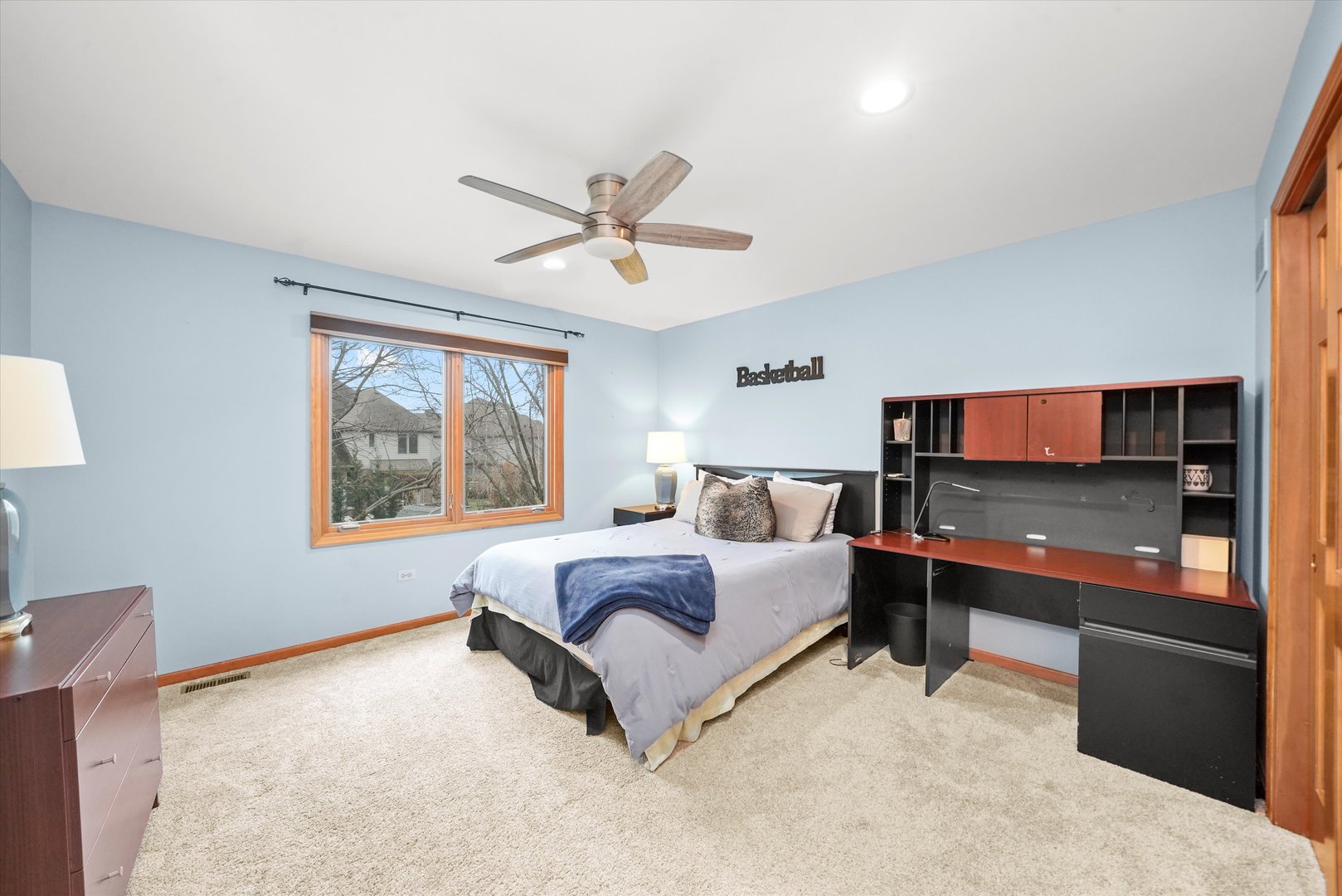 18 Newgate Avenue Naperville, IL 60565 - Photo 18 of 31 a spacious bedroom with a large bed and a chandelier