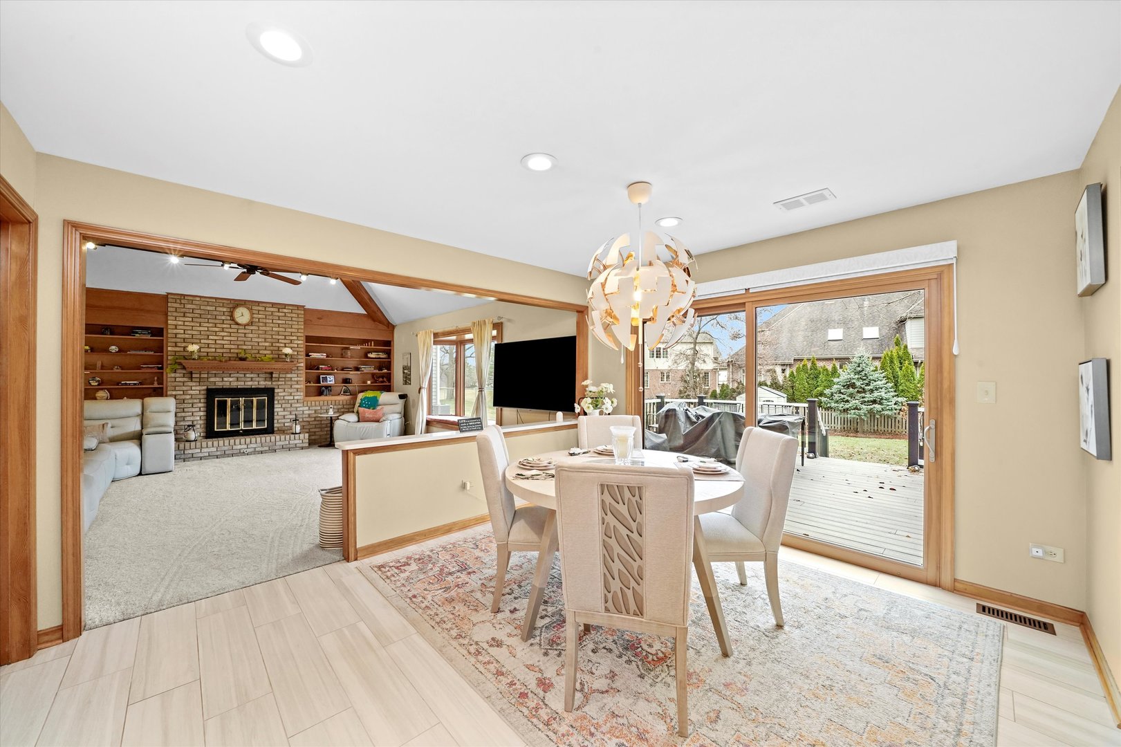 18 Newgate Avenue Naperville, IL 60565 - Photo 6 of 31 a view of a dining room with furniture wooden floor and chandelier