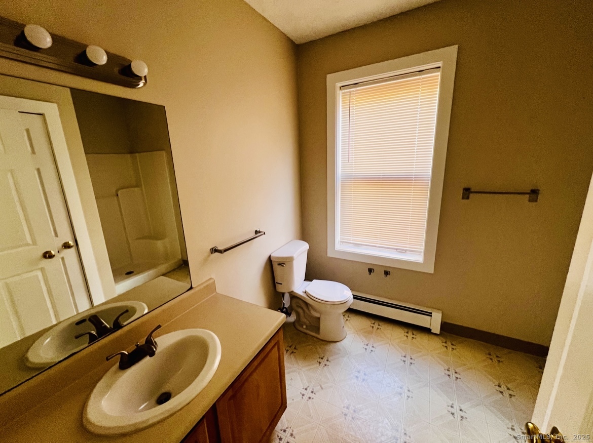 24 Mortson Street Hartford, CT 06106 - Photo 11 of 16 a bathroom with a sink and a tub