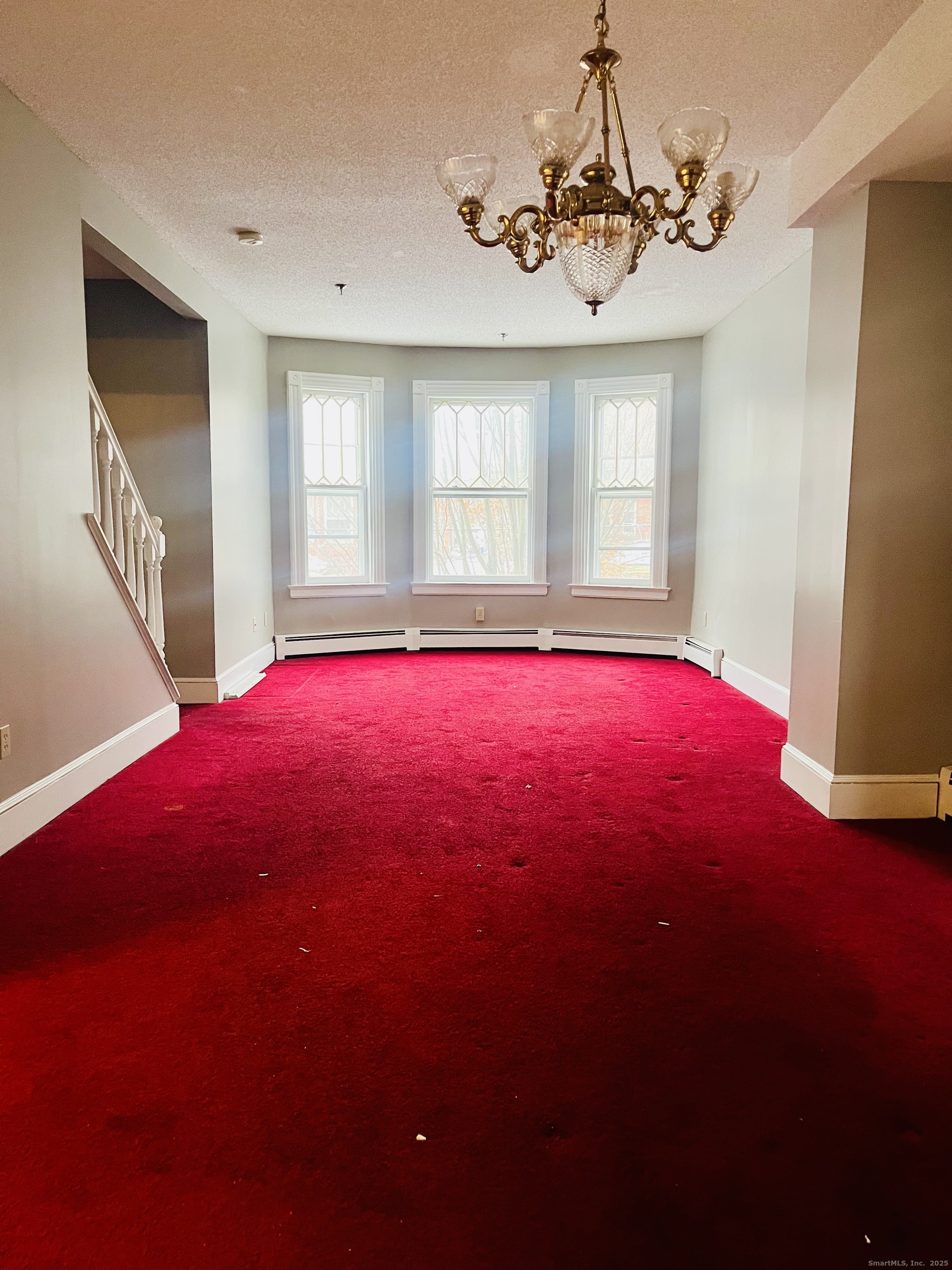24 Mortson Street Hartford, CT 06106 - Photo 4 of 16 a view of empty room with window and fireplace