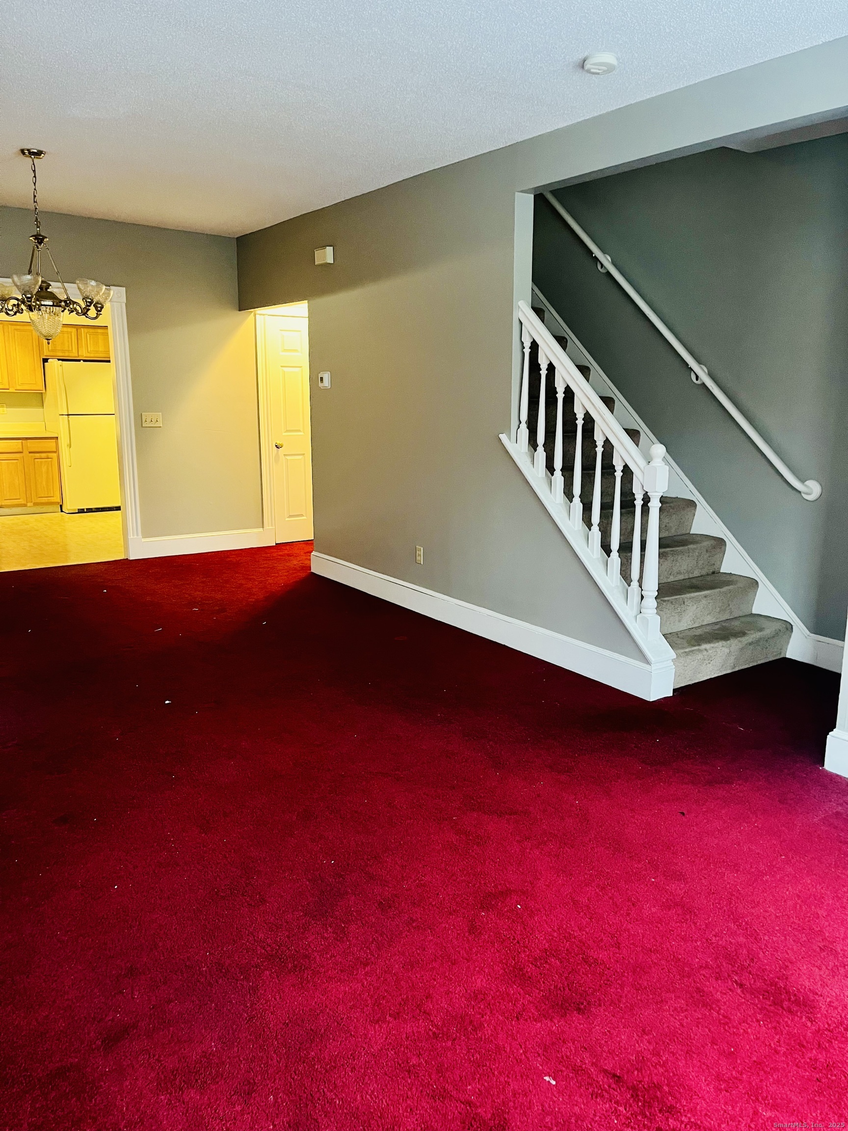 24 Mortson Street Hartford, CT 06106 - Photo 5 of 16 a view of an empty room with a window and a kitchen