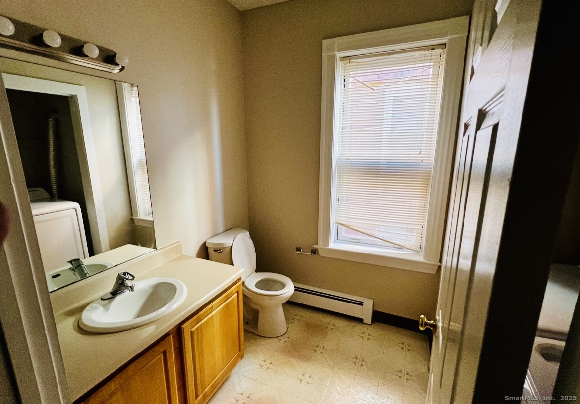 24 Mortson Street Hartford, CT 06106 - Photo 6 of 16 a bathroom with a sink and a mirror