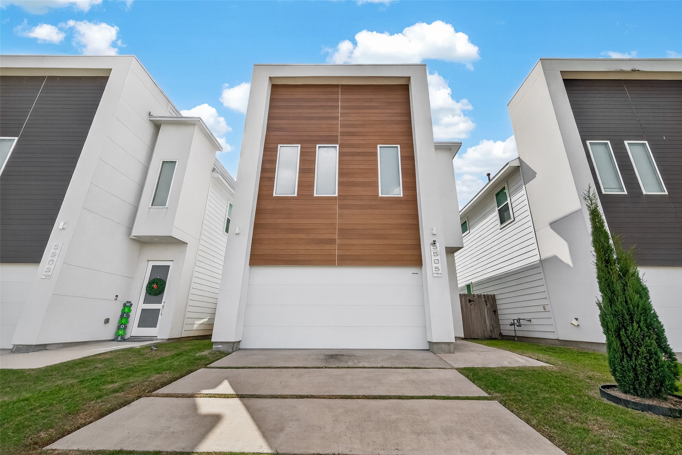 a front view of a house with a yard