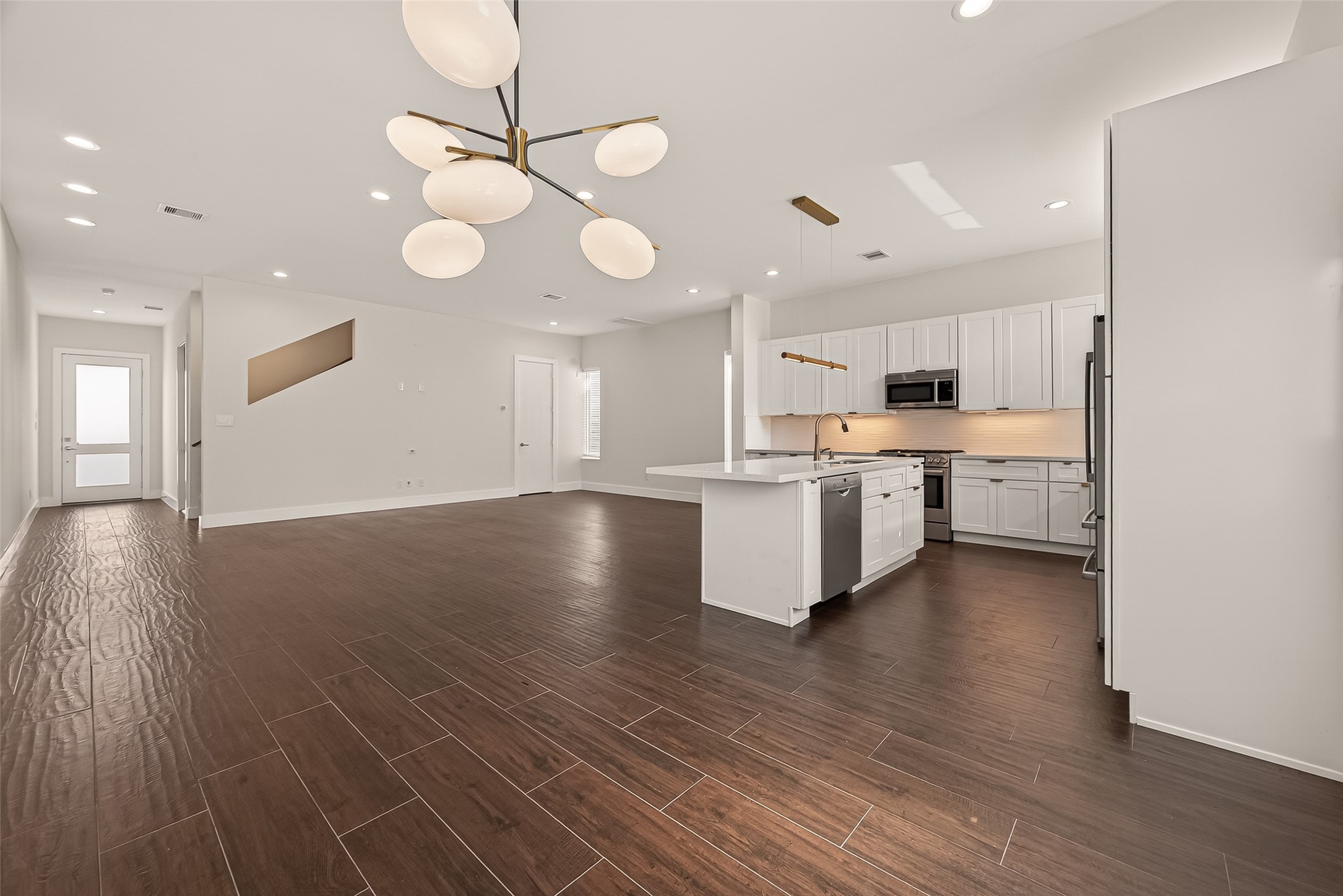 5505 Robusto Place Houston, TX 77091 - Photo 11 of 49 a view of kitchen with granite countertop cabinets and wooden floor