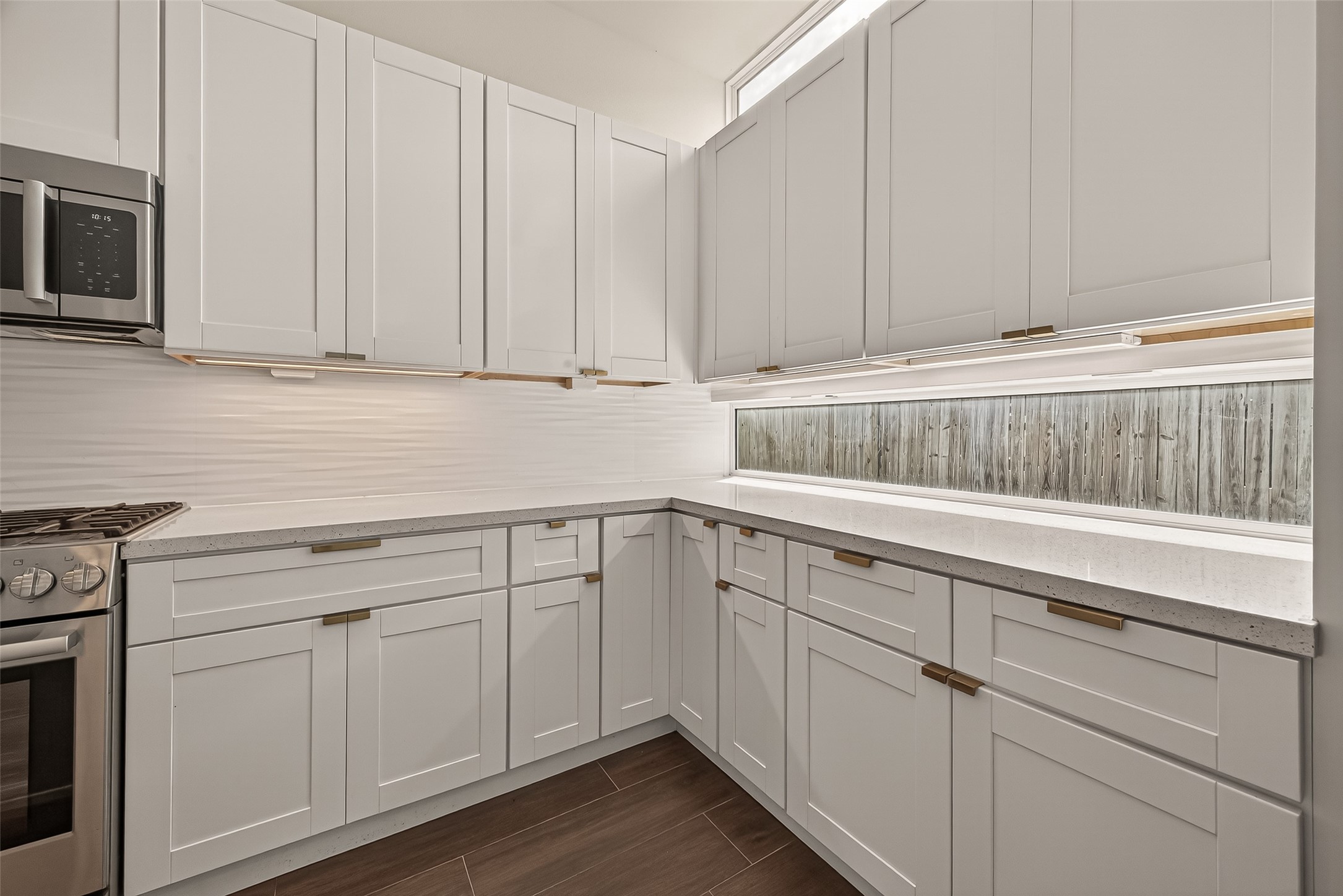 5505 Robusto Place Houston, TX 77091 - Photo 14 of 49 a kitchen with white cabinets and white appliances