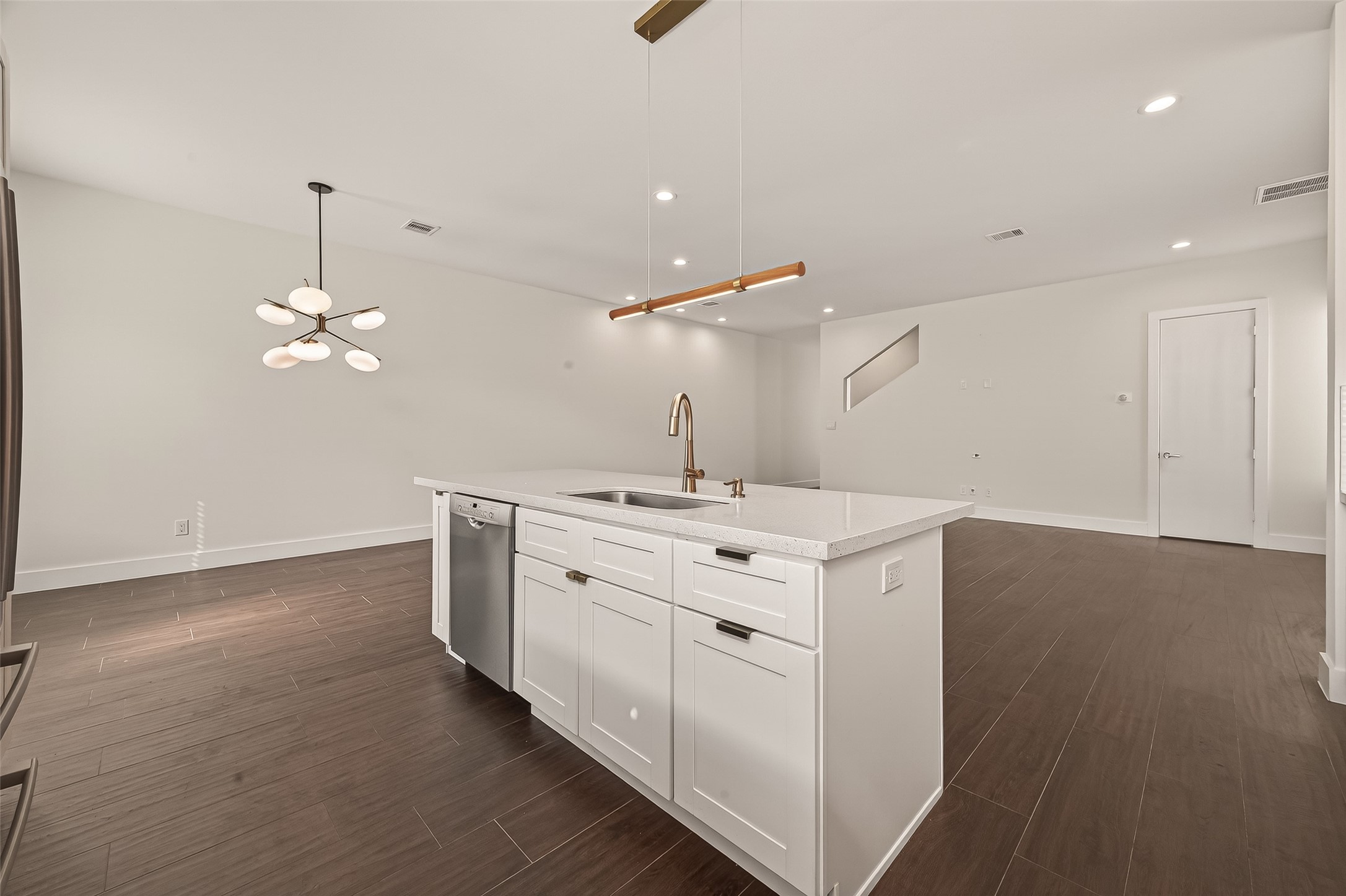 5505 Robusto Place Houston, TX 77091 - Photo 15 of 49 a kitchen that has a lot of cabinets and wooden floor