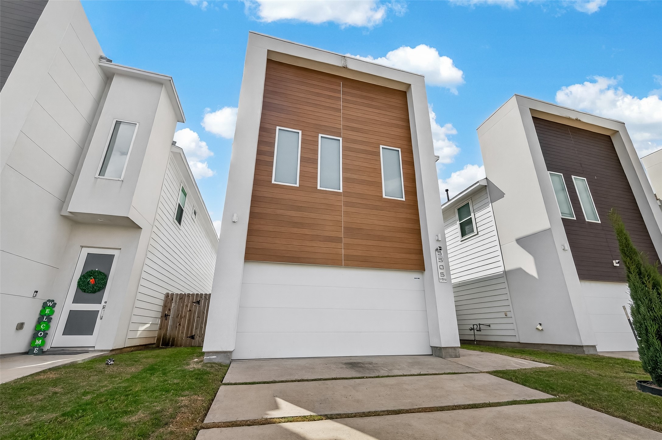 5505 Robusto Place Houston, TX 77091 - Photo 2 of 49 a front view of a house with a yard