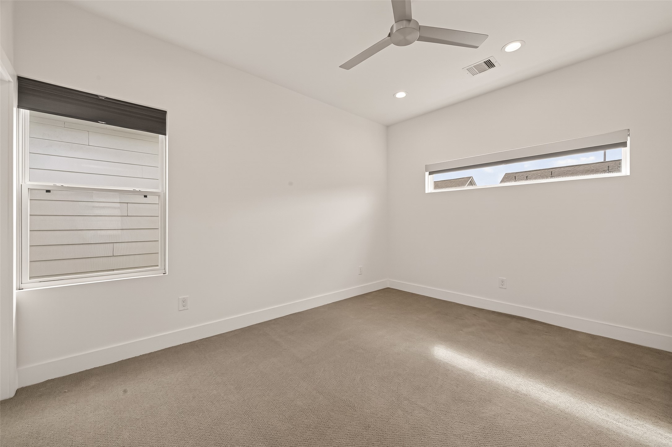 5505 Robusto Place Houston, TX 77091 - Photo 23 of 49 an empty room with a empty space and windows