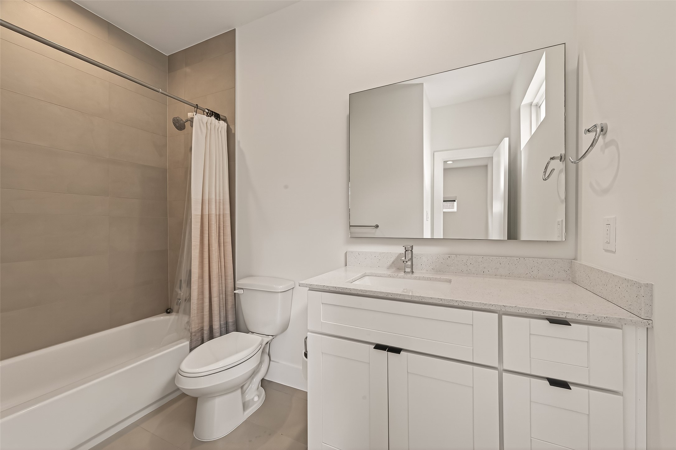 5505 Robusto Place Houston, TX 77091 - Photo 25 of 49 a bathroom with a sink toilet vanity and shower