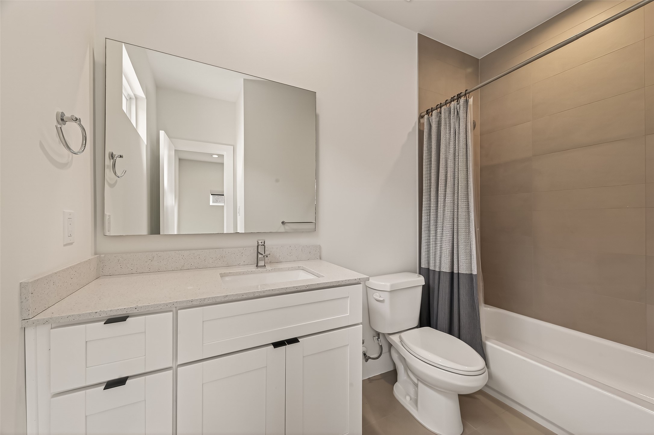 5505 Robusto Place Houston, TX 77091 - Photo 28 of 49 a bathroom with a sink toilet vanity and shower