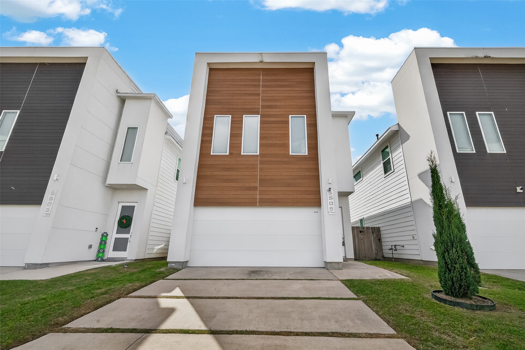 5505 Robusto Place Houston, TX 77091 - Photo 3 of 49 a front view of a house with a yard