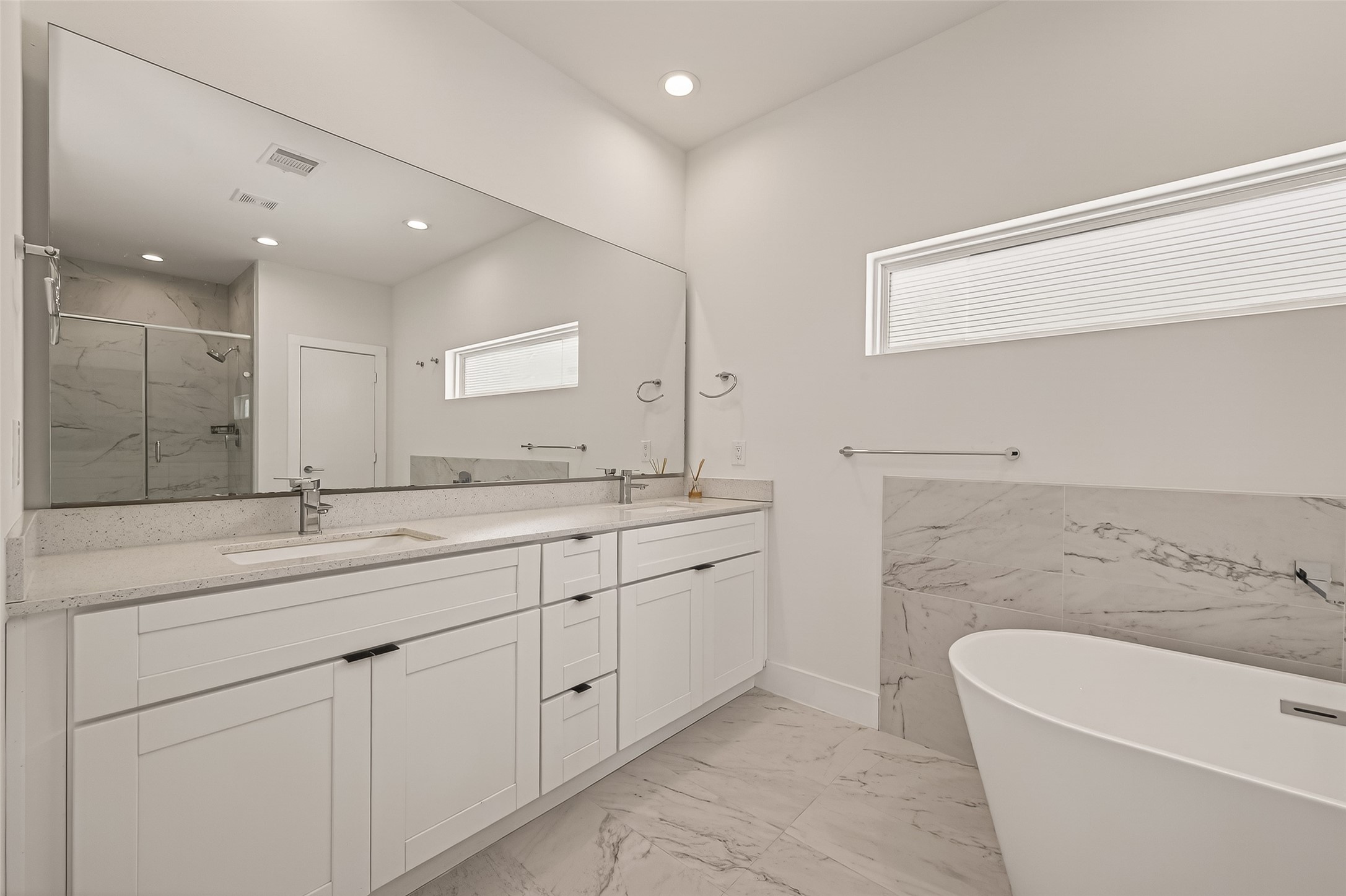 5505 Robusto Place Houston, TX 77091 - Photo 35 of 49 a bathroom with a granite countertop sink mirror and bathtub