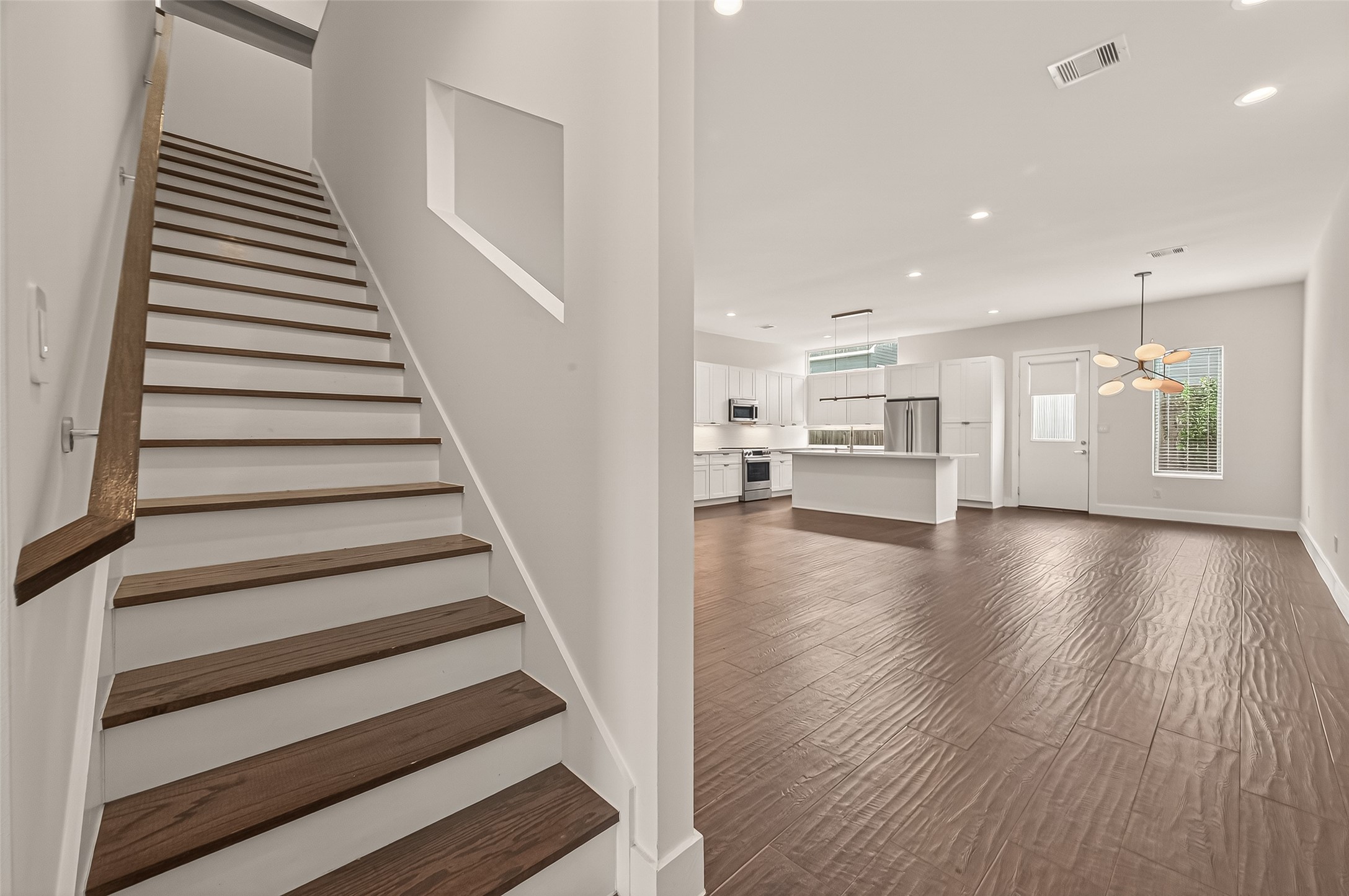 5505 Robusto Place Houston, TX 77091 - Photo 6 of 49 a view of a room with wooden floors and stairs