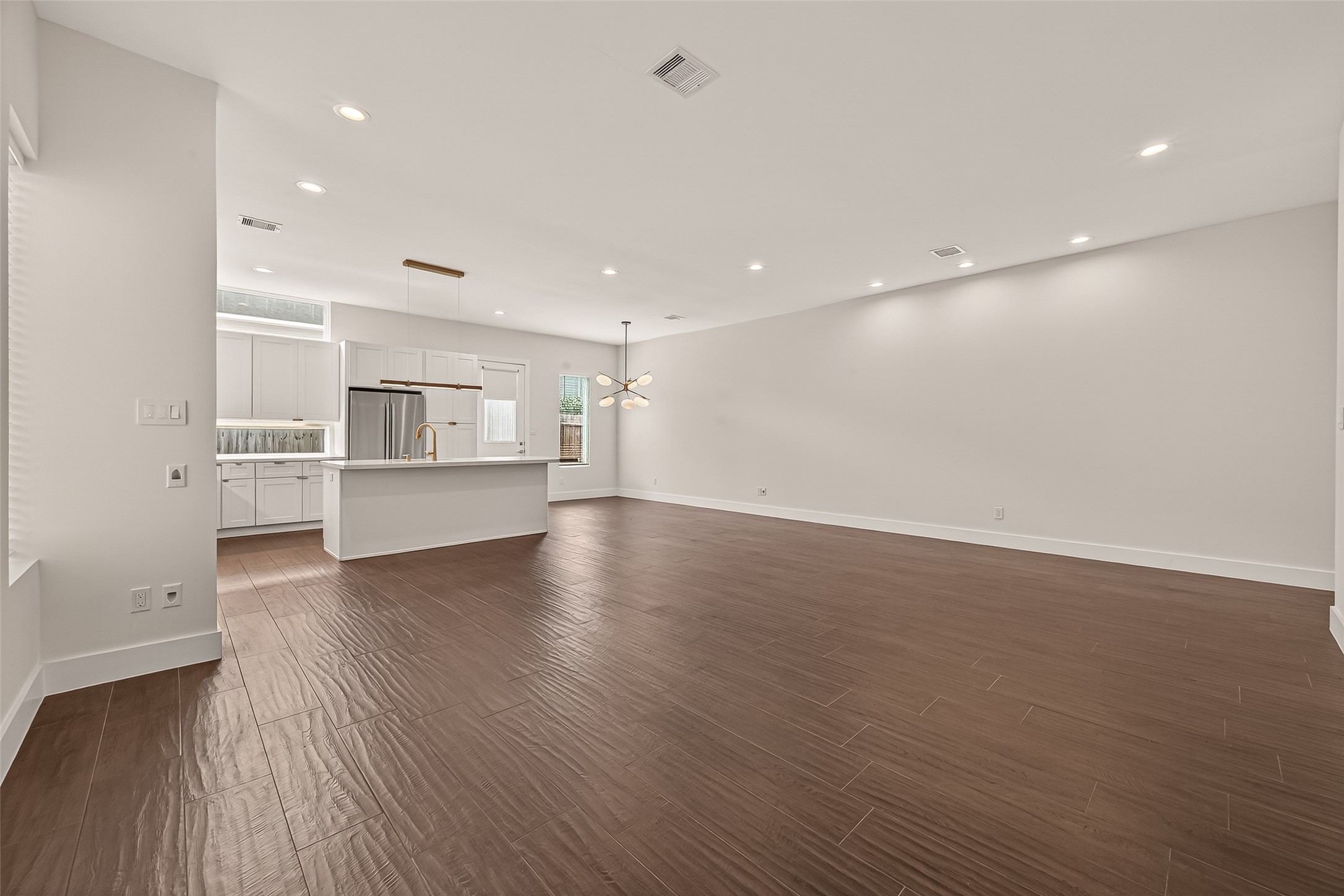 5505 Robusto Place Houston, TX 77091 - Photo 8 of 49 a view of a kitchen with wooden floor and windows