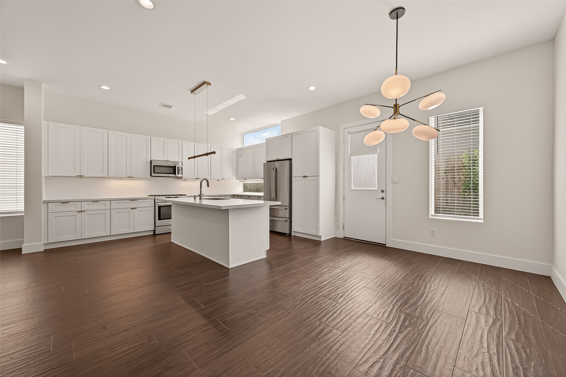 5505 Robusto Place Houston, TX 77091 - Photo 10 of 49 a view of kitchen with granite countertop stainless steel appliances cabinets and wooden floor