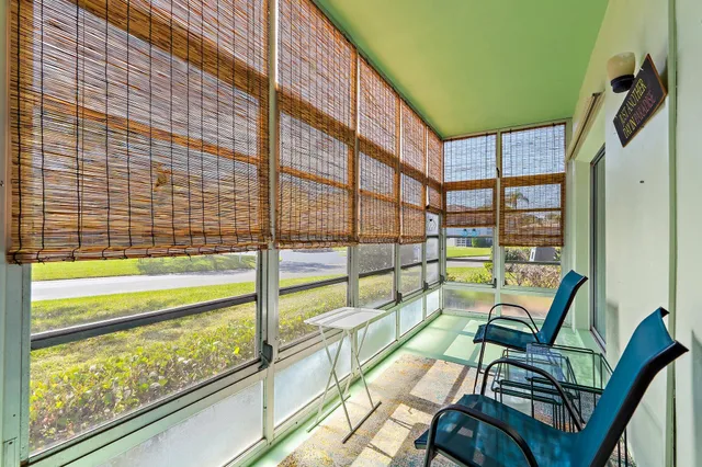 a view of a balcony with chairs