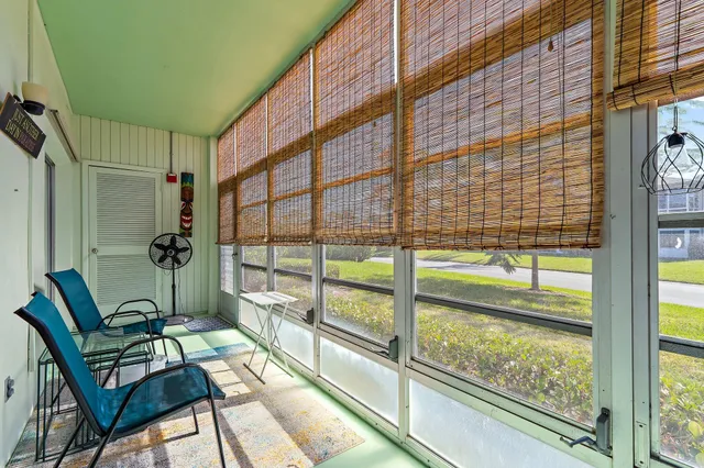 a view of balcony with wooden floor