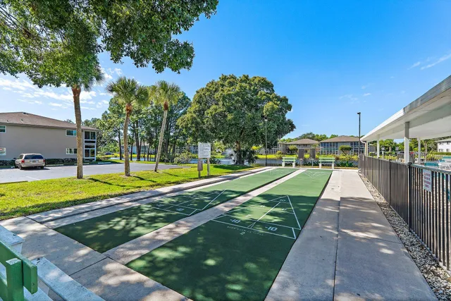 a view of a swimming pool with a lounge chair