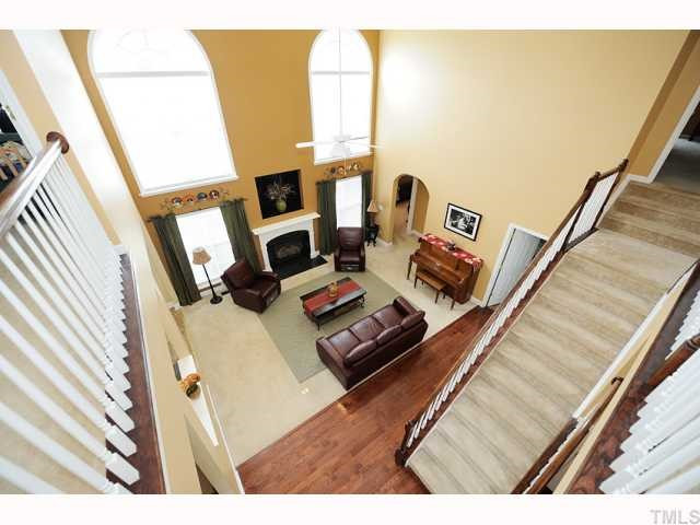 2-Story Family Room has bridge overlook and beautiful paladium windows