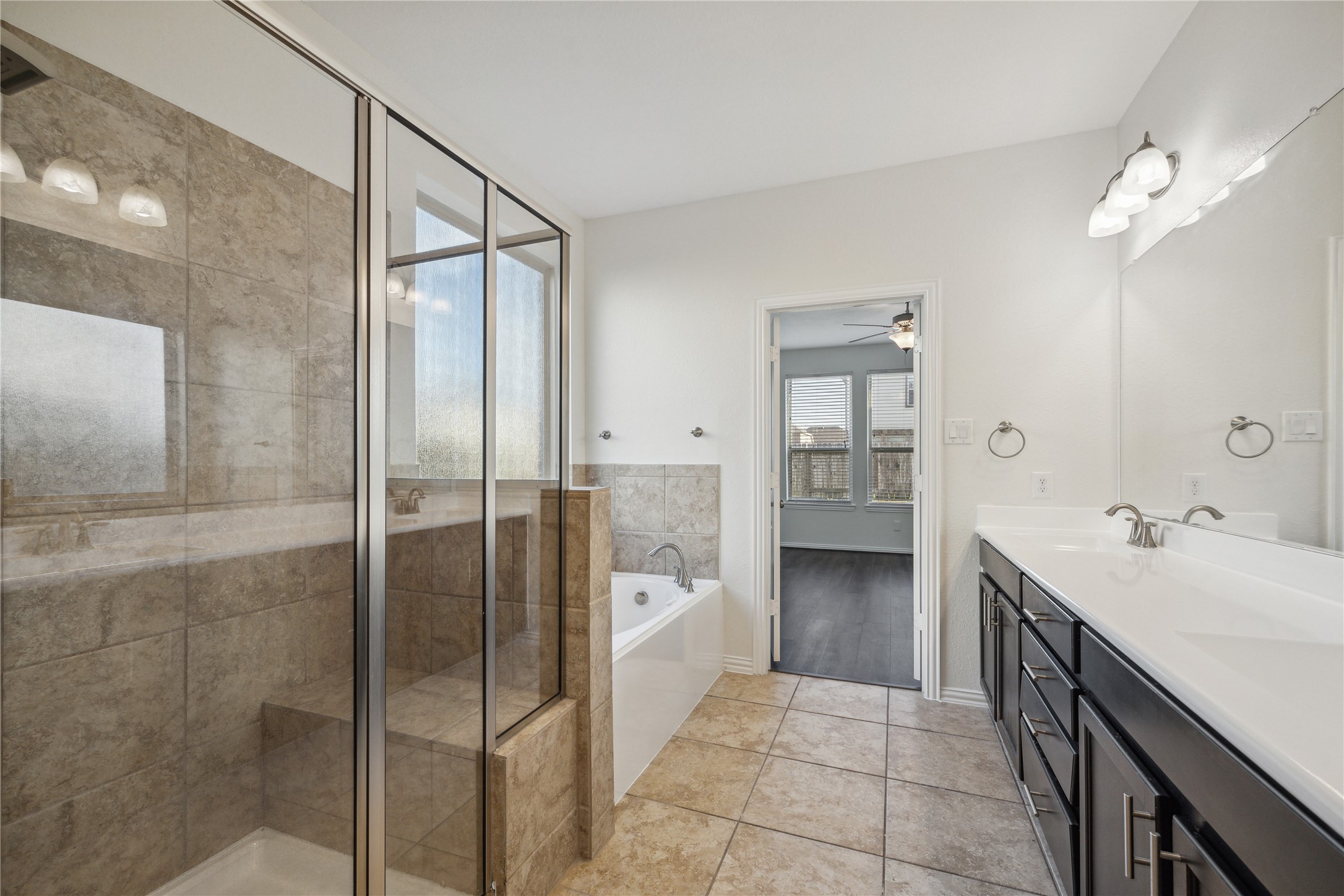 13108 Summit Harvest Lane Rosharon, TX 77583 - Photo 4 of 11 a bathroom with a double vanity sink and mirror