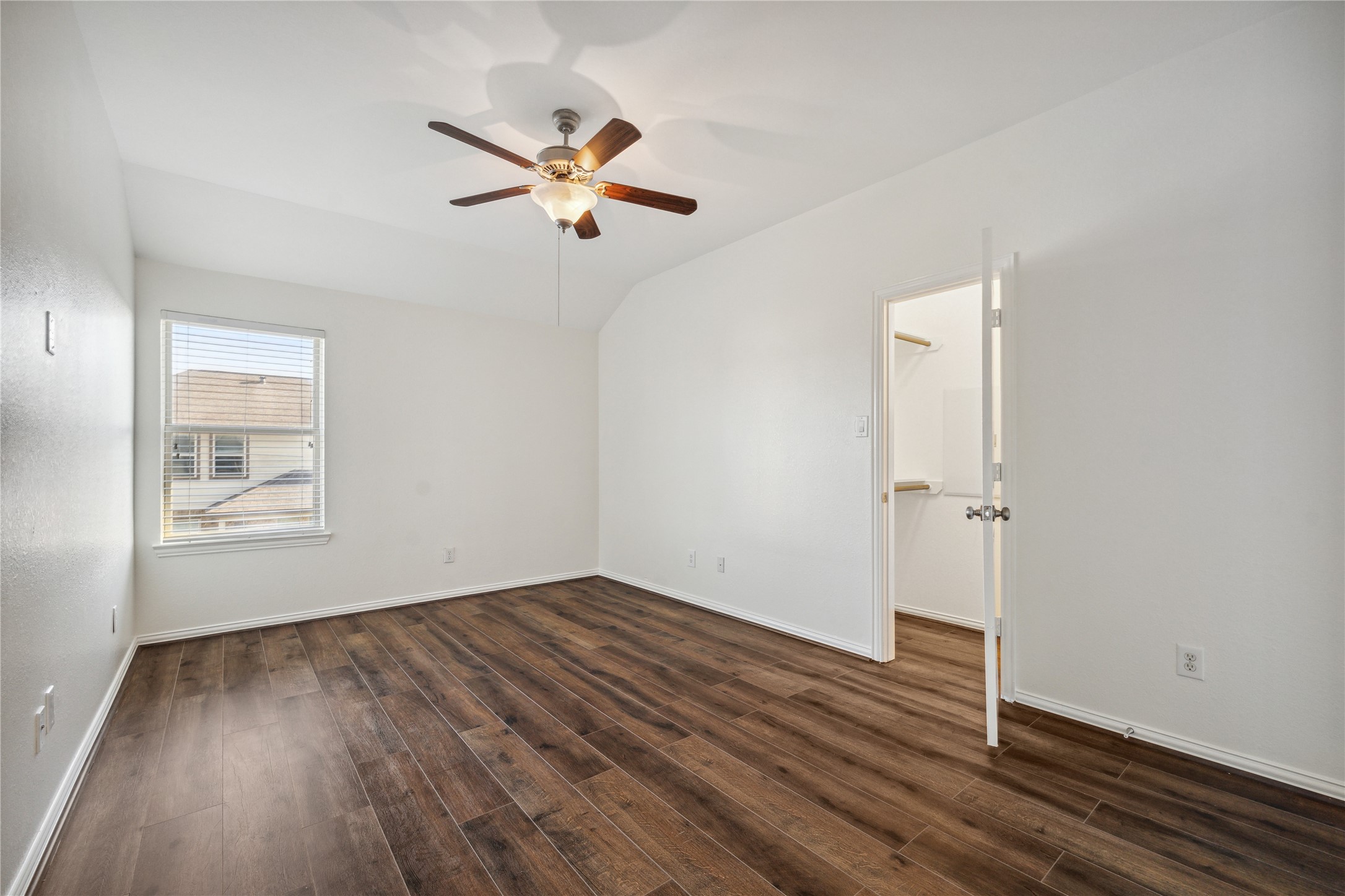 13108 Summit Harvest Lane Rosharon, TX 77583 - Photo 6 of 11 a view of a room with wooden floor closet and windows