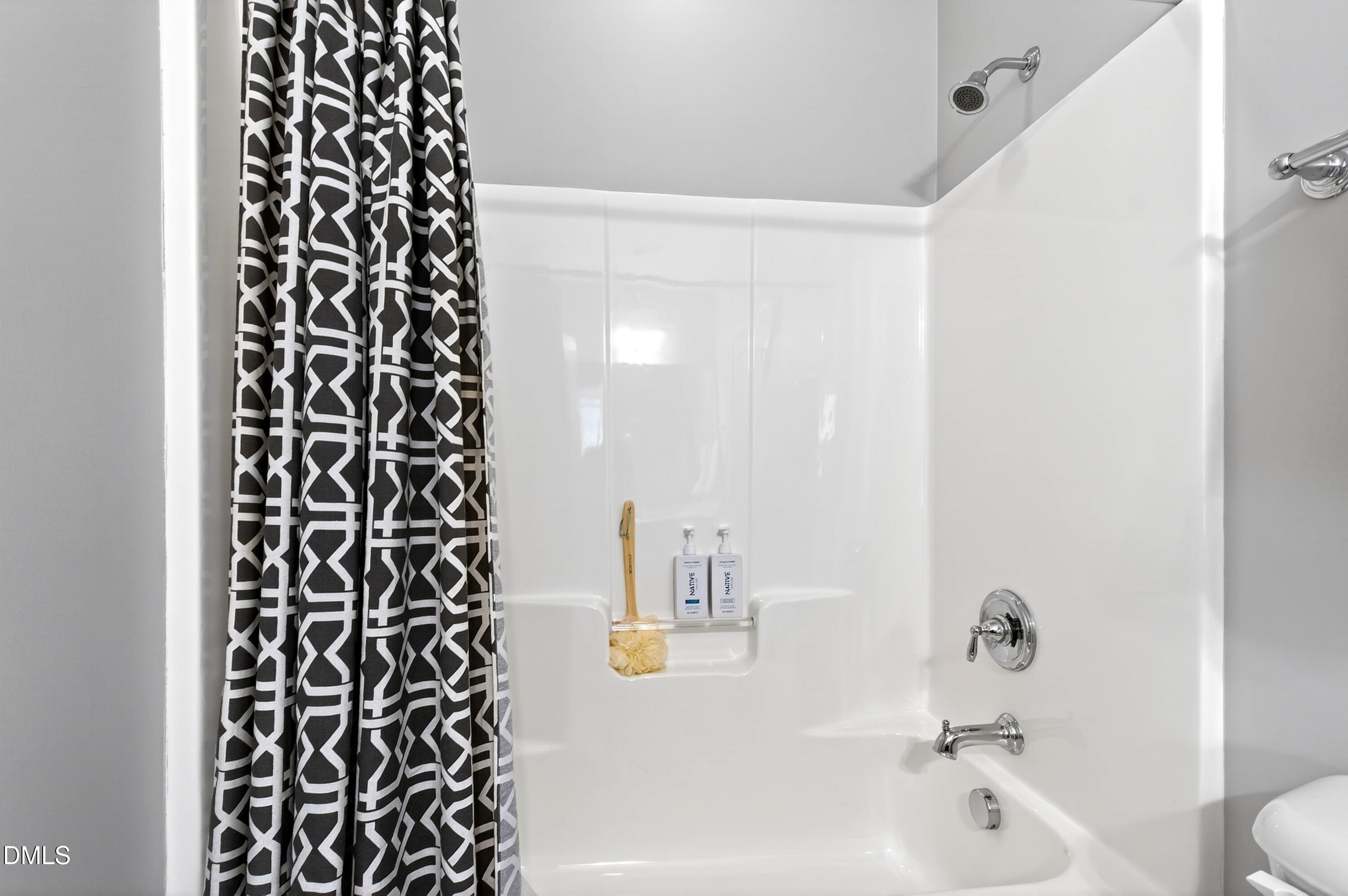 313 Karpen Lane Cary, NC 27519 - Photo 61 of 86 a bathroom with a bathtub and a shower