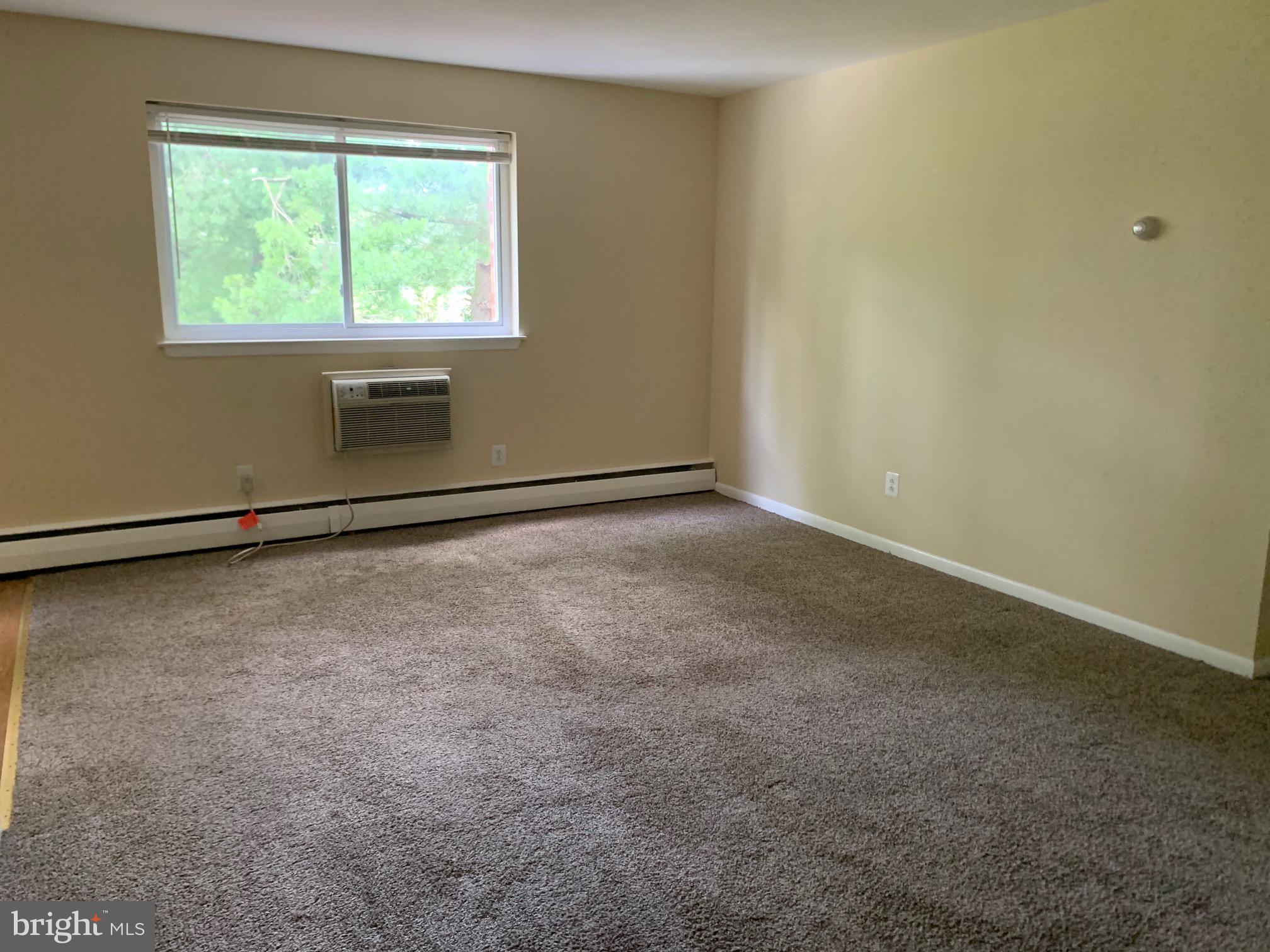 459 Hockersville Road, Unit 305 Hershey, PA 17033 - Photo 3 of 14 an empty room with a empty space and windows