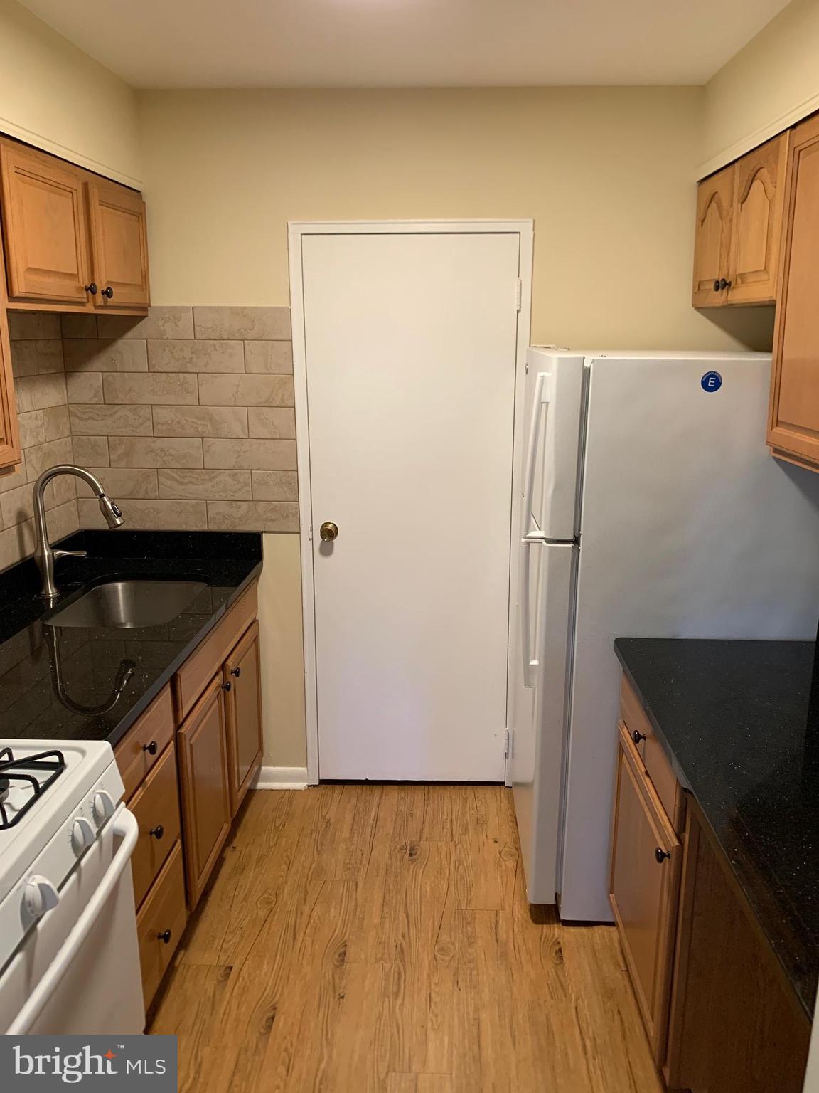 459 Hockersville Road, Unit 305 Hershey, PA 17033 - Photo 8 of 14 a kitchen with a refrigerator and a stove