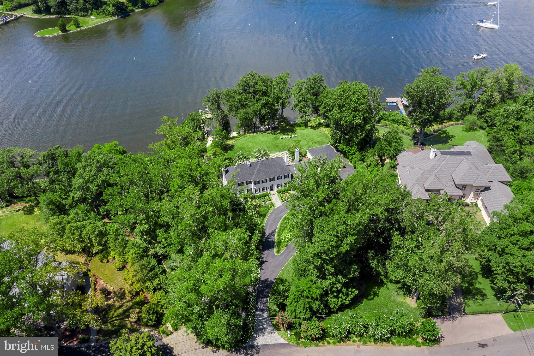 an aerial view of a house with a yard and outdoor space