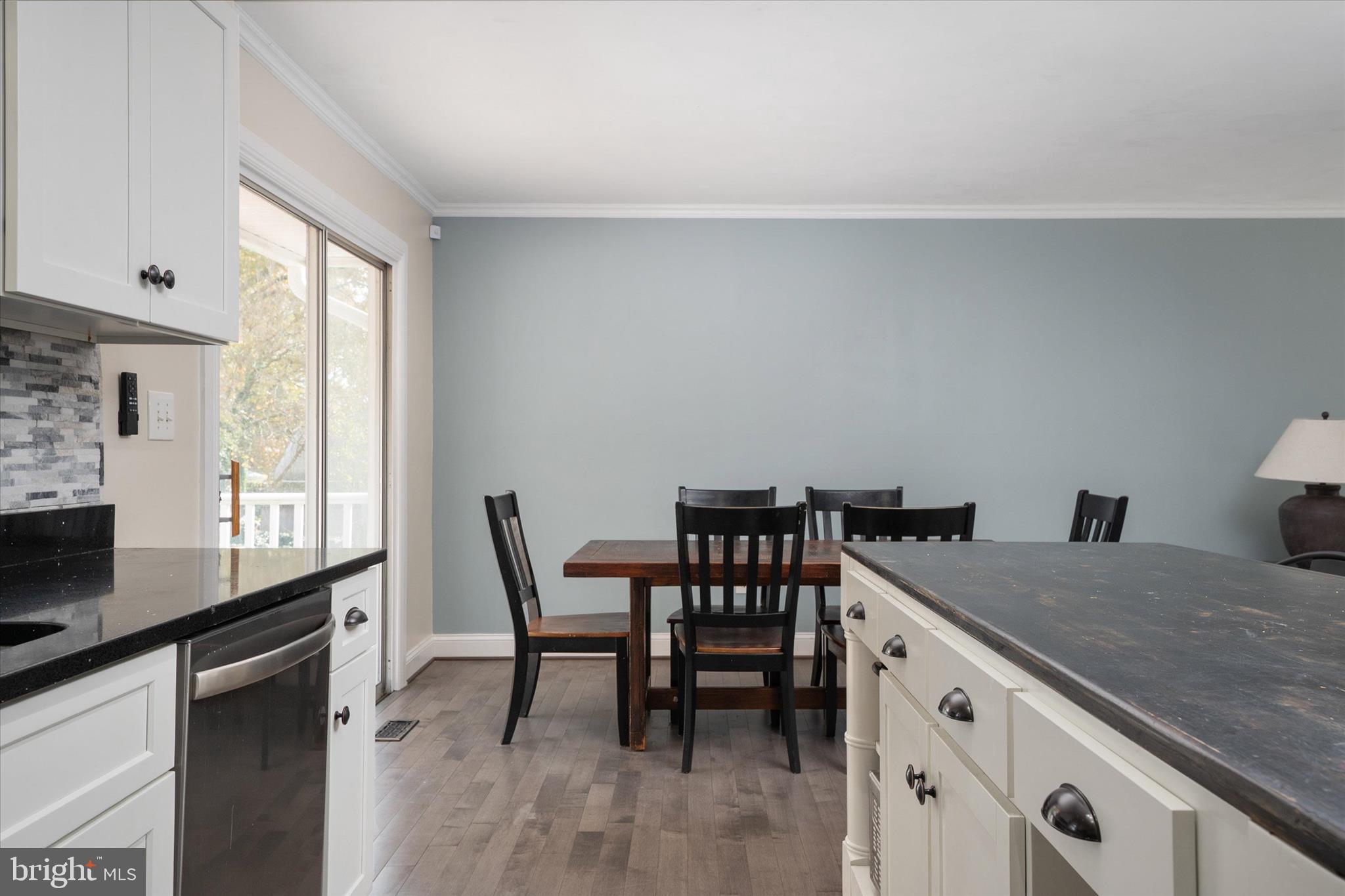 155 Barbara Road Severna Park, MD 21146 - Photo 8 of 51 a kitchen that has a microwave a table and chairs in it