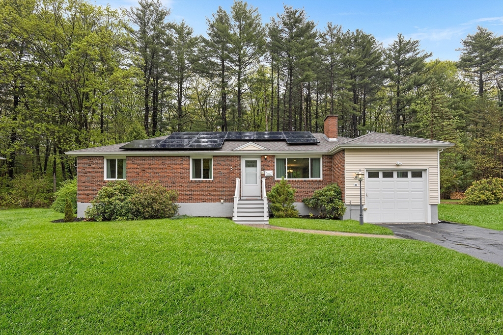 31 Livoli Road Framingham, MA 01701 - Photo 1 of 32 a front view of a house with a garden and yard