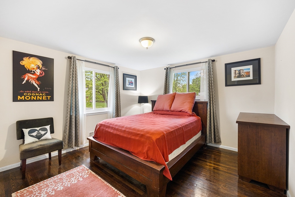 31 Livoli Road Framingham, MA 01701 - Photo 14 of 32 a bed room with a bed and a painting on the wall