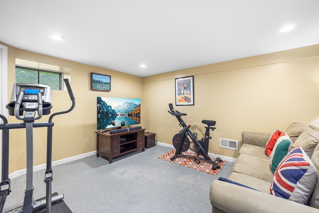 31 Livoli Road Framingham, MA 01701 - Photo 21 of 32 a living room with furniture and a flat screen tv
