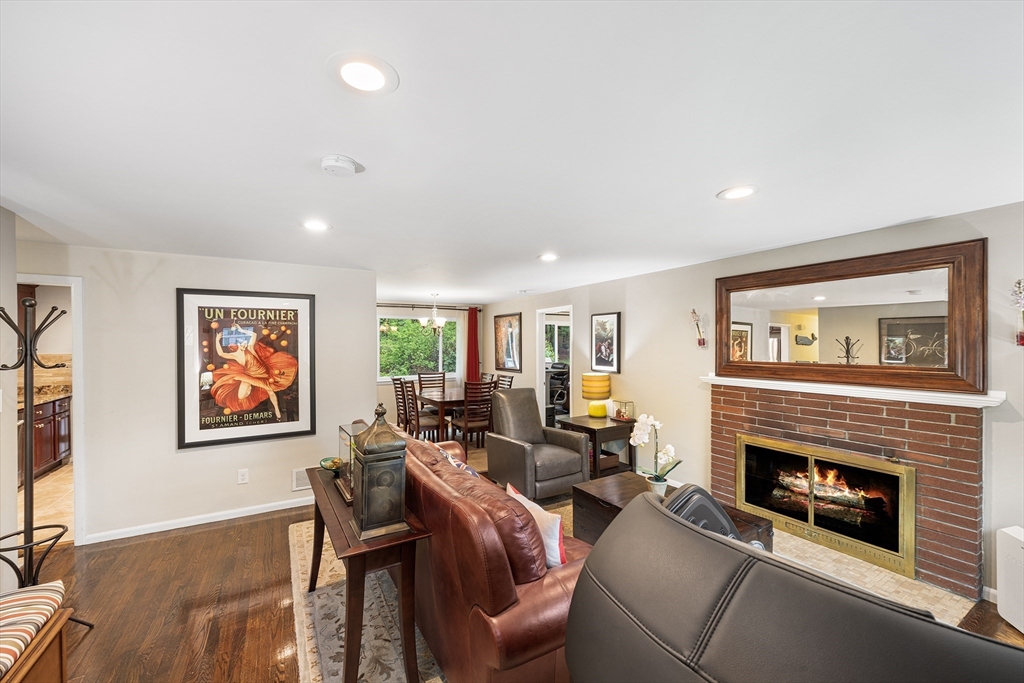 31 Livoli Road Framingham, MA 01701 - Photo 6 of 32 a living room with furniture a large window and a fireplace