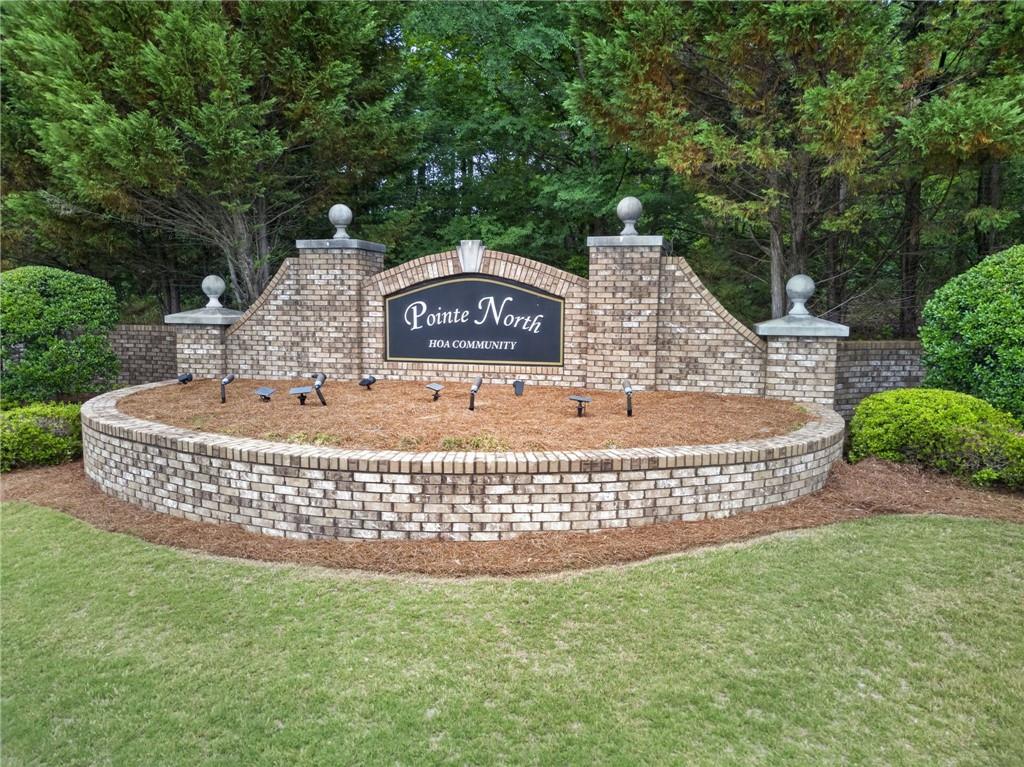 6 Radian Way Dallas, GA 30132 - Photo 6 of 10 a view of a garden with a bench