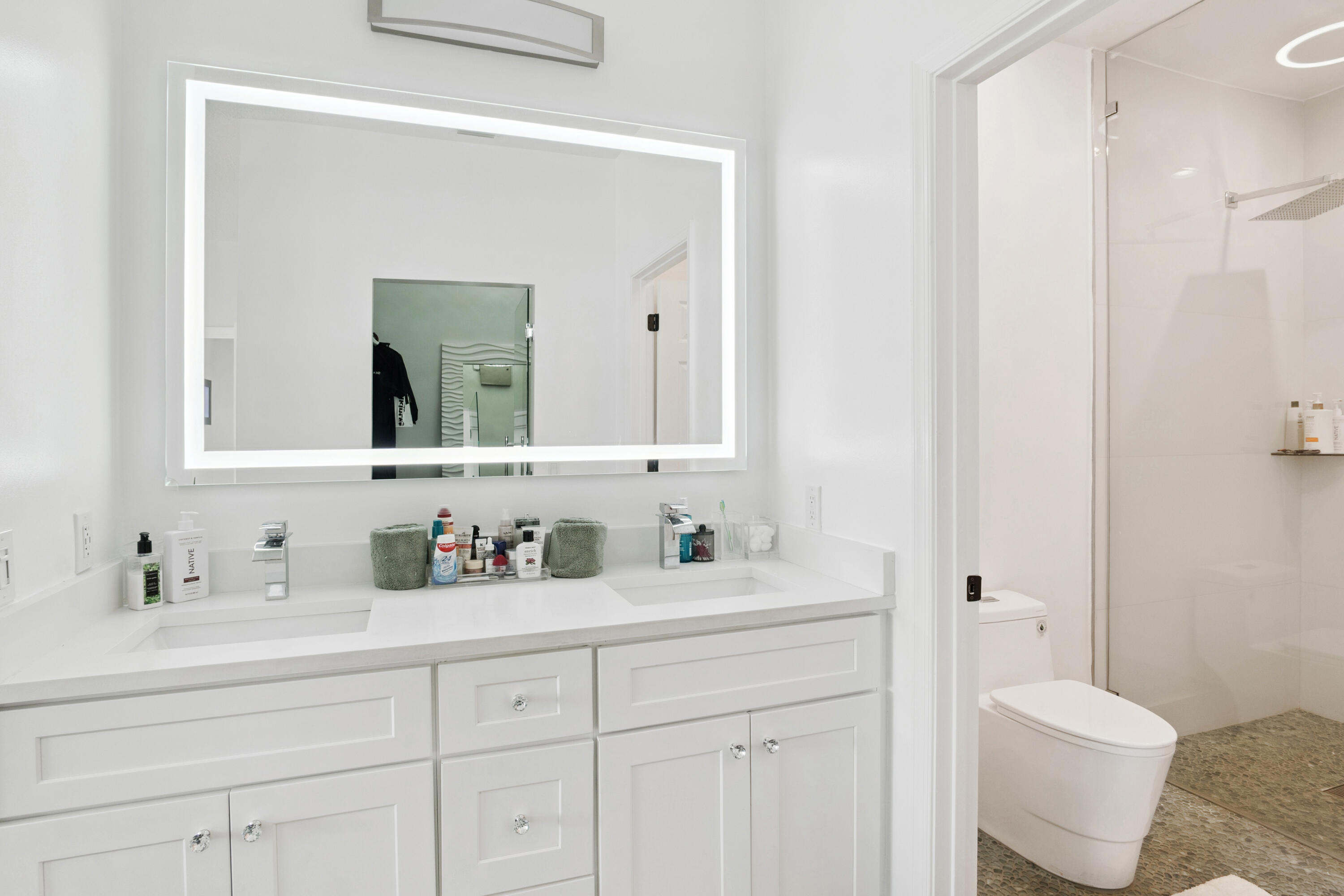 7110 Northwest Turtle Walk Boca Raton, FL 33487 - Photo 12 of 36 a bathroom with a toilet sink and mirror